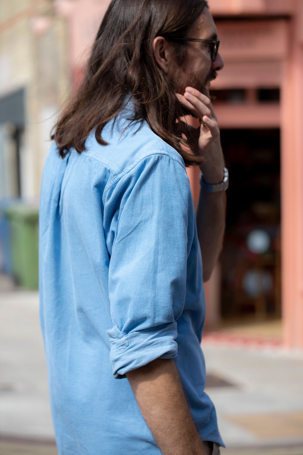 Max Dunne in a blue corduroy shirt, looking away down the street